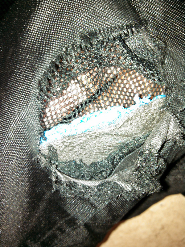 Joe Rocket mesh jacket, right arm closeup, outer layer abraded away resulting in a large hole on the outer forearm. Inner armour severely abraded, but inner liner still intact. There is no melting of the outer or inner material. 65 mph motorcycle crash. Photo by Mia389