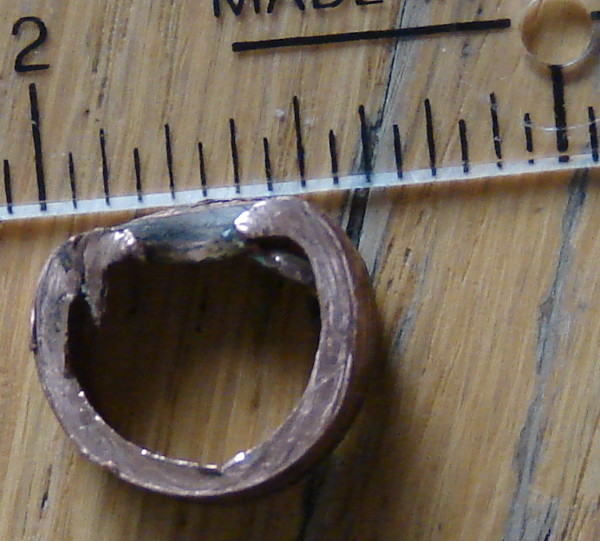 A saddle valve pierces the copper pipe and deforms the pipe out of round, so a copper sleeve with a round diameter no longer fits. Photo by Don Tai.