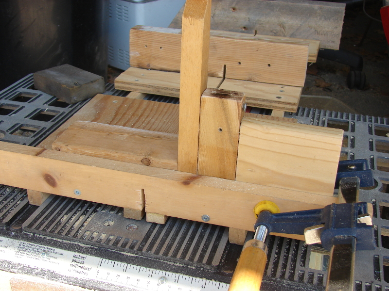 Very simple jig to cut tight dadoes. Rightmost cut: wood to dado, wood that will be inserted into dado, jig (non-screw end), stop block clamped. Photo 6 by Don Tai