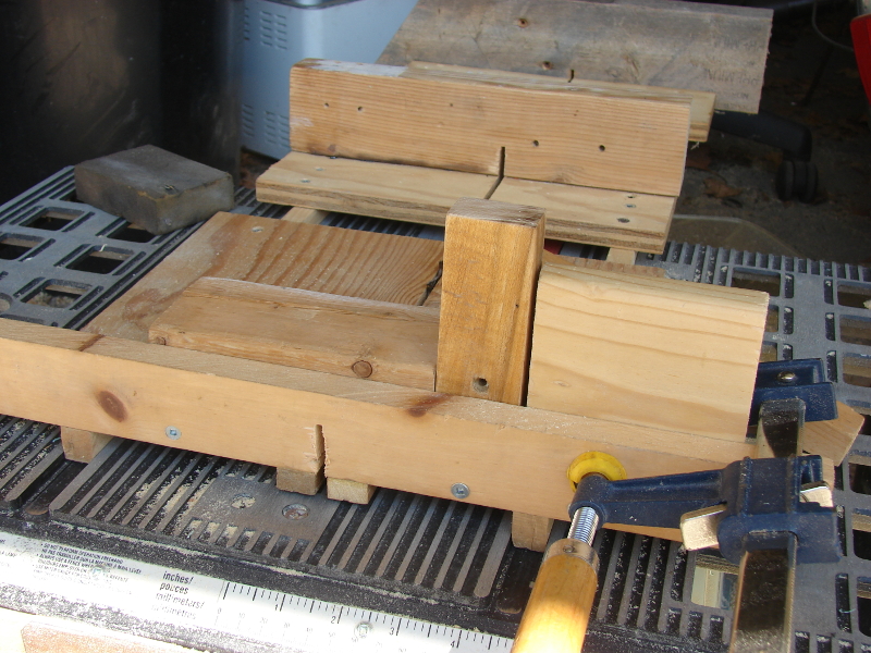 Very simple jig to cut tight dadoes. Leftmost cut: wood to dado, jig (screw end), stop block clamped. Photo 8 by Don Tai