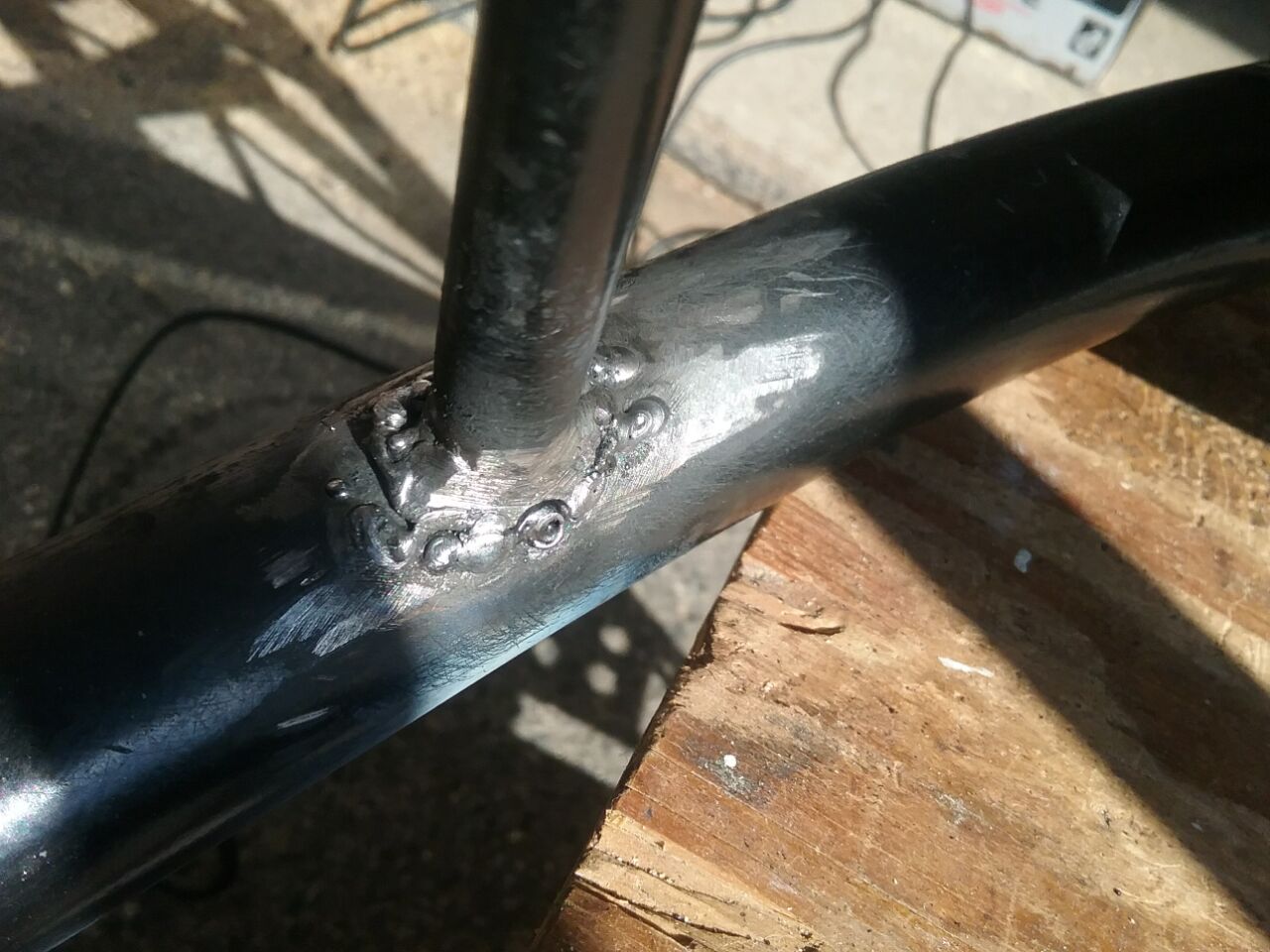 Reweld a broken stud on a cheaply made Chinese chair, 2020 Jan. Photo by Don Tai