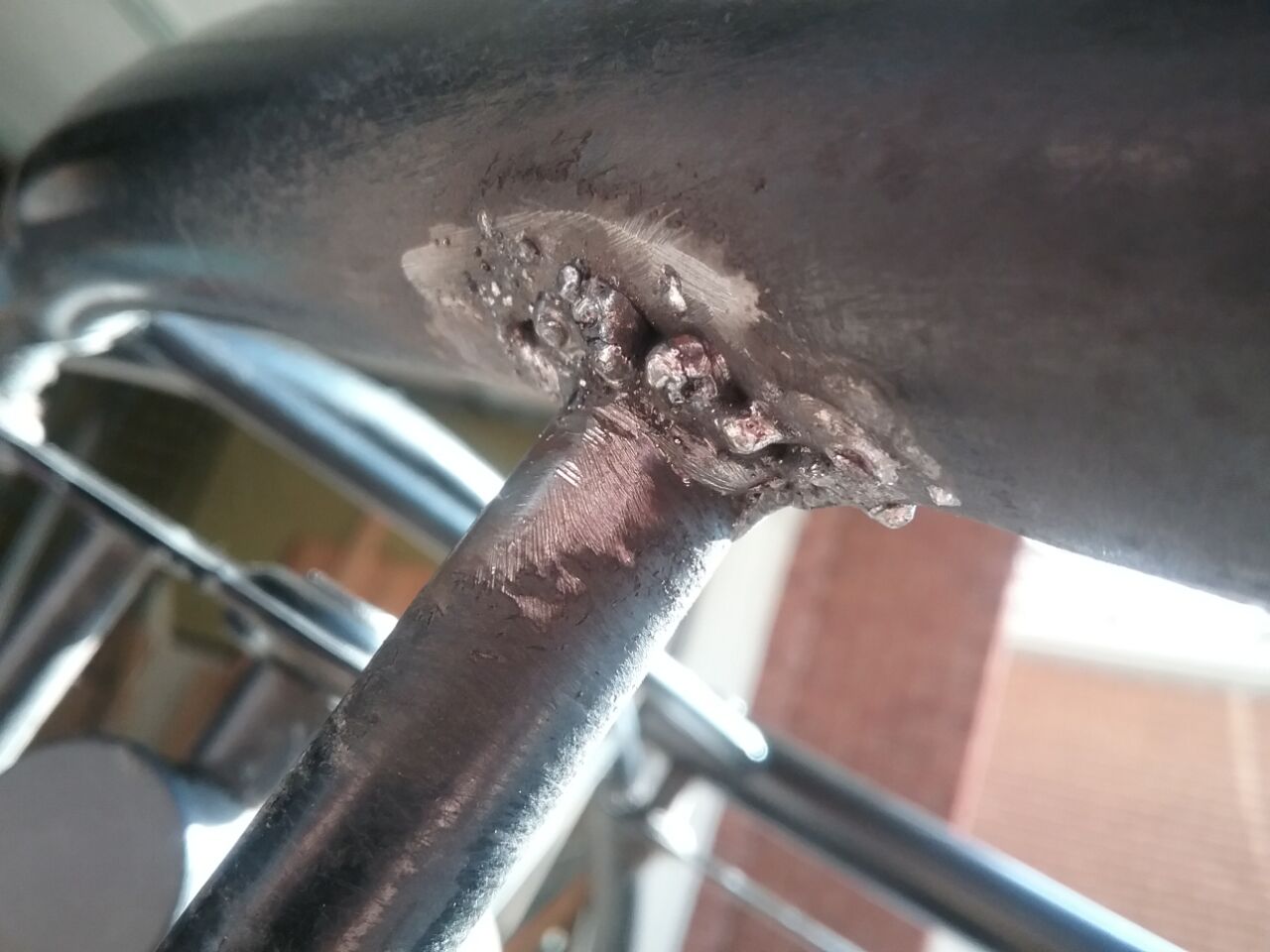 Reweld a broken stud on a cheaply made Chinese chair, 2020 Jan. Photo by Don Tai