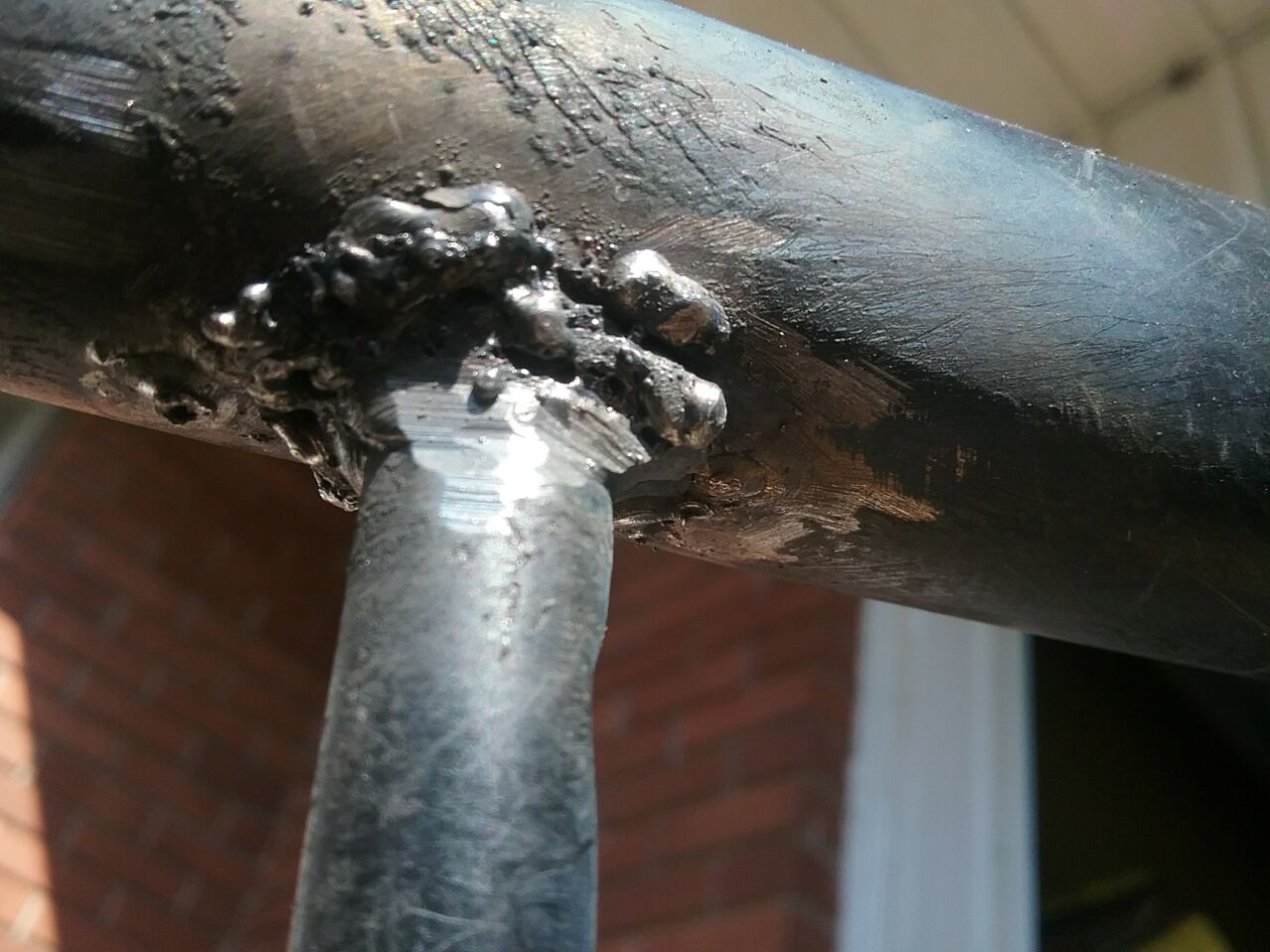 Little Weed’s metal recliner broke a strut that stabilizes the left and right sides. Had to reposition the chair multiple times to get a good view of the round strut. Rewelded 2020 Oct 23. Photo 6 by Don Tai