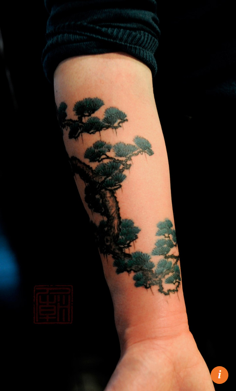 Hong Kong tattoo artist Joey Pang has a Chinese style similar to Chinese painting. Her work is very lovely. A stand of mountain pine trees