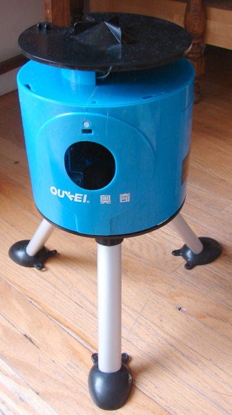 The Oukei TW-2700-E1 Table Tennis Training Machine is a consumer grade serving machine. It stopped working due to an out of aligned spring. Photo 2 by Don Tai